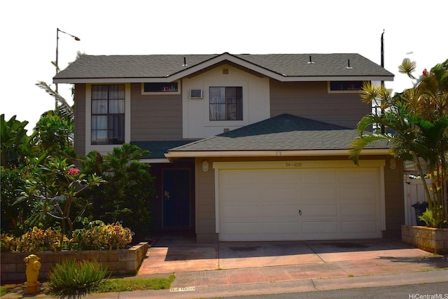 94-1059 Pouhana Way Unit 3, Waipahu, HI 96797 - view of front of house featuring a garage and a shingled roof
