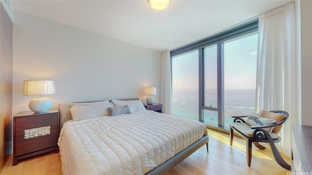 1108 Auahi St Unit 3201, Honolulu, HI 96814 - bedroom with light wood-style flooring
