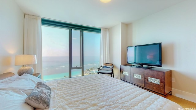 1108 Auahi St Unit 3201, Honolulu, HI 96814 - bedroom with multiple windows and wood finished floors