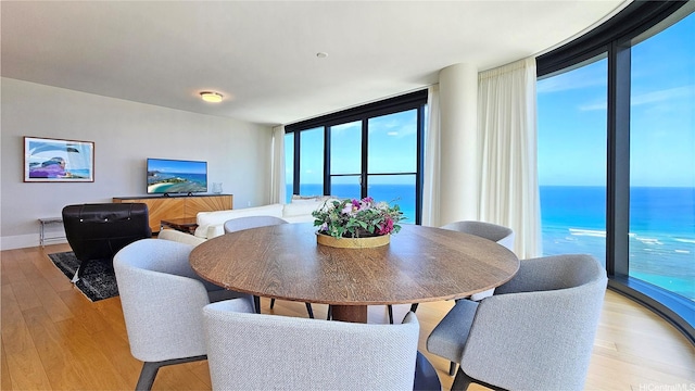 1108 Auahi St Unit 3201, Honolulu, HI 96814 - dining area with light wood finished floors and expansive windows