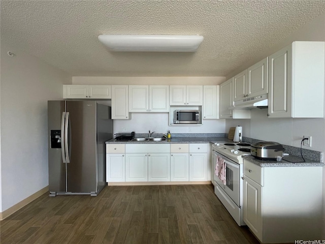 801 S St Unit 3603, Honolulu, HI 96813 - kitchen with appliances with stainless steel finishes, dark wood-style flooring, under cabinet range hood, white cabinetry, and a textured ceiling
