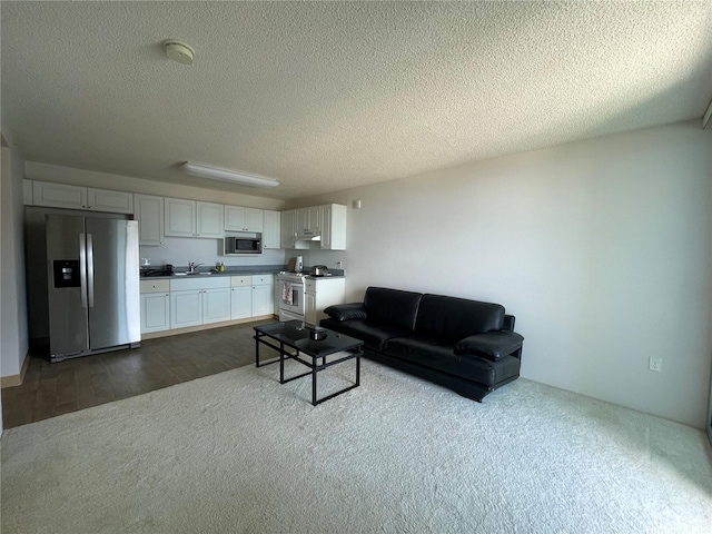 801 S St Unit 3603, Honolulu, HI 96813 - living room with a textured ceiling, dark carpet, and dark wood-style flooring