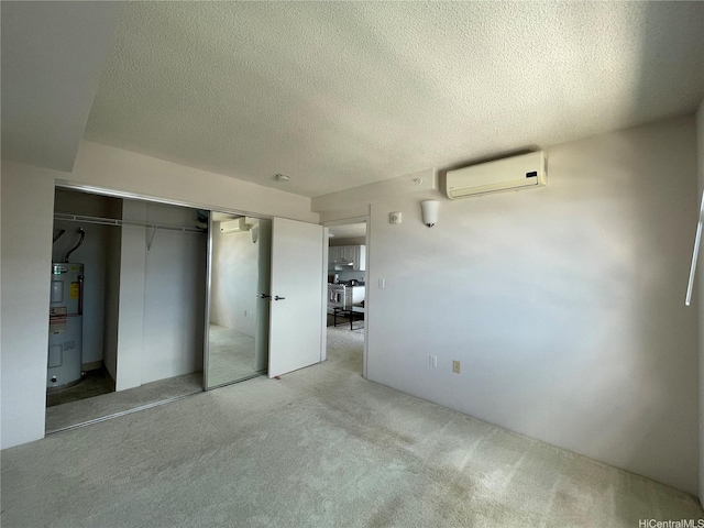 801 S St Unit 3603, Honolulu, HI 96813 - unfurnished bedroom with an AC wall unit, water heater, carpet, a closet, and a textured ceiling