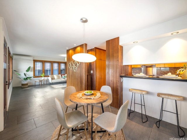 2527 Henry St Unit A, Honolulu, HI 96817 - dining room featuring an AC wall unit, wooden walls, and recessed lighting