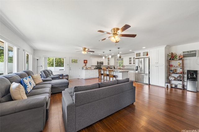 66-342-A Aukai Ln Unit 2, Haleiwa, HI 96712 - living room featuring a ceiling fan, dark wood-style floors, a wall mounted AC, and recessed lighting