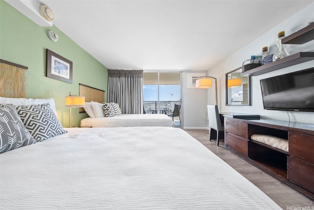 445 Seaside Ave Unit 3203, Honolulu, HI 96815 - bedroom with wood finished floors