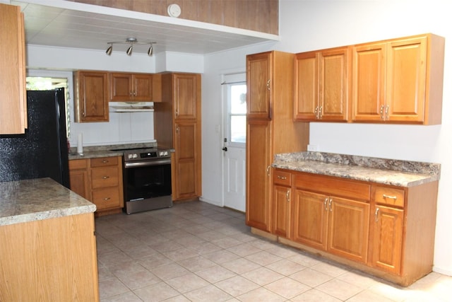 45-610 Kipawale Pl, Kaneohe, HI 96744 - kitchen featuring stainless steel electric range oven, freestanding refrigerator, under cabinet range hood, and brown cabinets