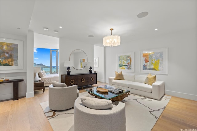 1108 Auahi St Unit 3800, Honolulu, HI 96814 - living room featuring a chandelier, light wood-style flooring, and recessed lighting