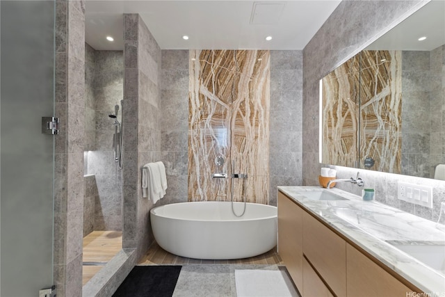 1108 Auahi St Unit 3800, Honolulu, HI 96814 - full bath with tile walls, a stall shower, a freestanding bath, double vanity, and recessed lighting