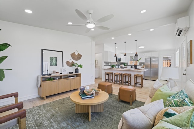 91-821 Kehue St, Ewa Beach, HI 96706 - living area with an AC wall unit, light wood-type flooring, a ceiling fan, and recessed lighting