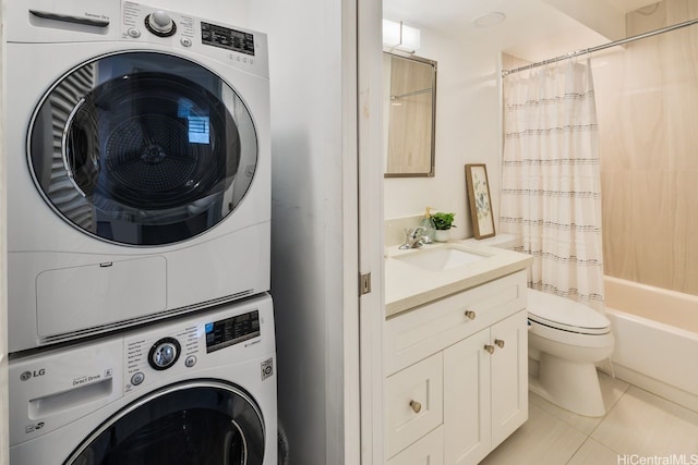 469 Ena Rd Unit 2004, Honolulu, HI 96815 - washroom with stacked washer / dryer and light tile patterned floors