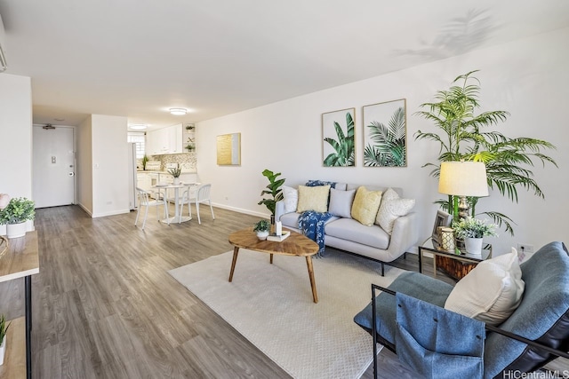 469 Ena Rd Unit 2004, Honolulu, HI 96815 - living area featuring wood finished floors and baseboards