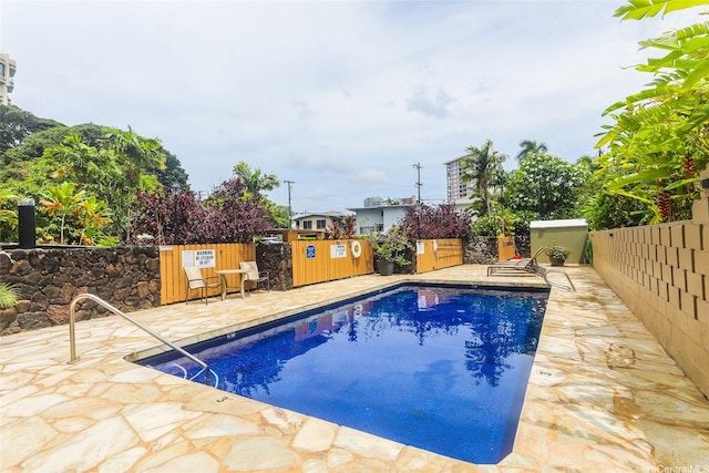 1550 Wilder Ave Unit A202, Honolulu, HI 96822 - community pool with a fenced backyard and a patio