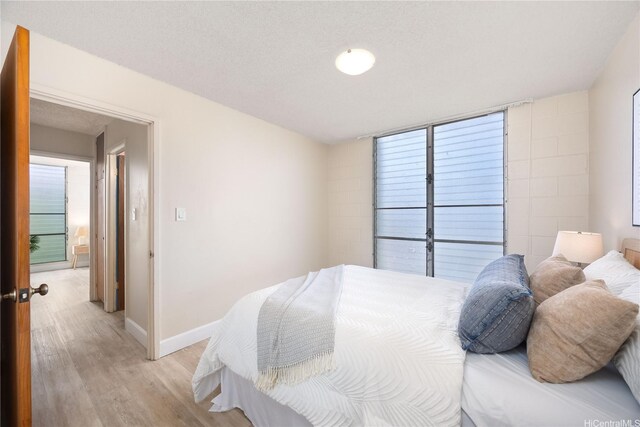 906 Lehua Ave Unit A306, Pearl City, HI 96782 - bedroom with light wood-style floors and multiple windows