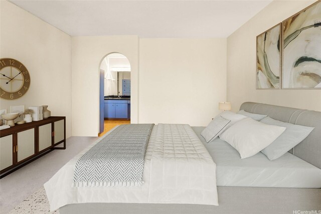 430 Lewers St Unit 2502, Honolulu, HI 96815 - bedroom with arched walkways and ensuite bath