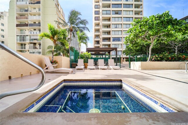 430 Lewers St Unit 2502, Honolulu, HI 96815 - view of swimming pool with a community hot tub and a patio area