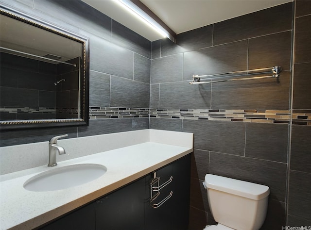 1560 Kanunu St Unit 1316, Honolulu, HI 96814 - full bath with tile walls, toilet, vanity, tiled shower, and tasteful backsplash