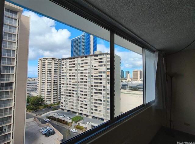 1560 Kanunu St Unit 1316, Honolulu, HI 96814 - interior space featuring a view of city and a textured ceiling