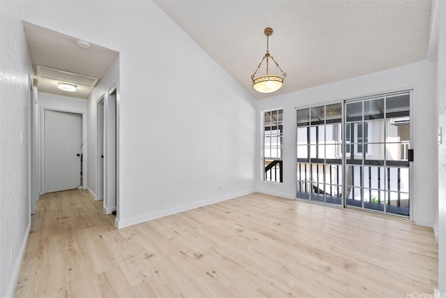1305 Lunalilo Home Rd, Honolulu, HI 96825 - unfurnished room with lofted ceiling, wood finished floors, and baseboards