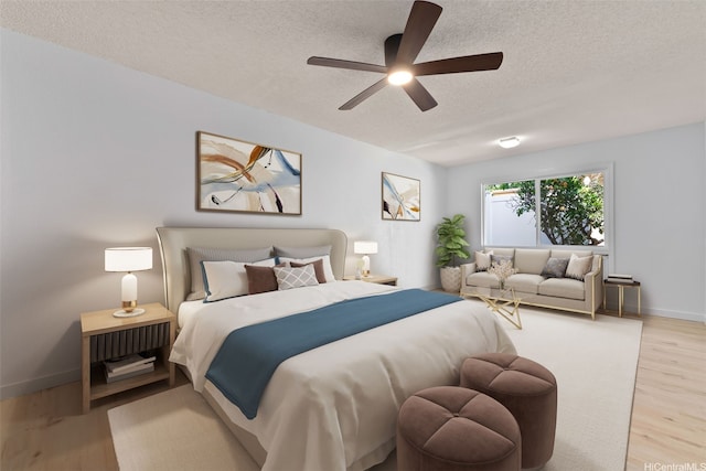 1305 Lunalilo Home Rd, Honolulu, HI 96825 - bedroom featuring a textured ceiling, light wood finished floors, baseboards, and a ceiling fan