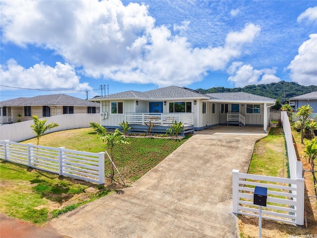 45-420 Pua Makahala St, Kaneohe, HI 96744 - single story home with concrete driveway and board and batten siding
