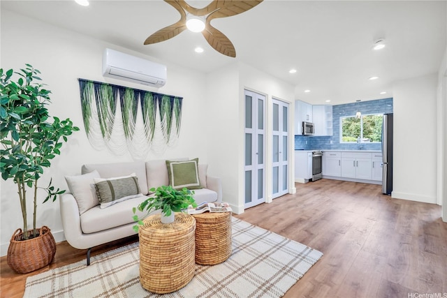 45-420 Pua Makahala St, Kaneohe, HI 96744 - living area featuring a wall mounted air conditioner, ceiling fan, light wood-style flooring, and recessed lighting