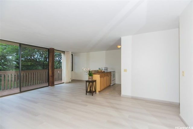 84-757 Kiana Pl Unit 6/21A, Waianae, HI 96792 - living room with light wood-style flooring and floor to ceiling windows