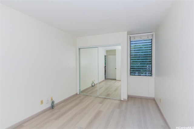 84-757 Kiana Pl Unit 6/21A, Waianae, HI 96792 - unfurnished bedroom with wood finished floors and a closet