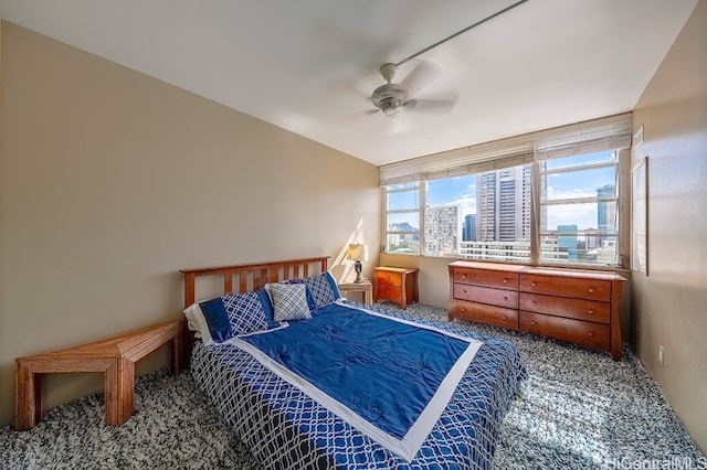 400 Hobron Ln Unit 1609, Honolulu, HI 96815 - carpeted bedroom featuring ceiling fan and a city view