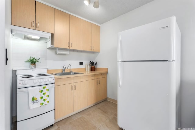 909 Kahuna Ln Unit 305, Honolulu, HI 96826 - kitchen featuring white appliances, under cabinet range hood, light brown cabinets, light countertops, and light tile patterned floors