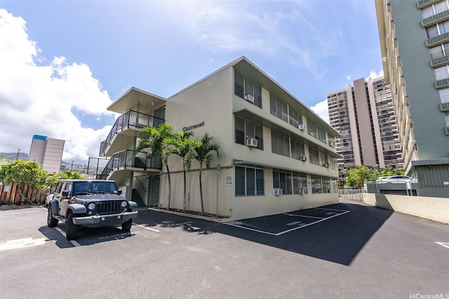 909 Kahuna Ln Unit 305, Honolulu, HI 96826 - view of property featuring uncovered parking