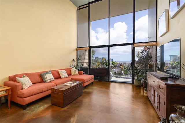 666 Prospect St Unit I502, Honolulu, HI 96813 - living room with a high ceiling, concrete flooring, and expansive windows