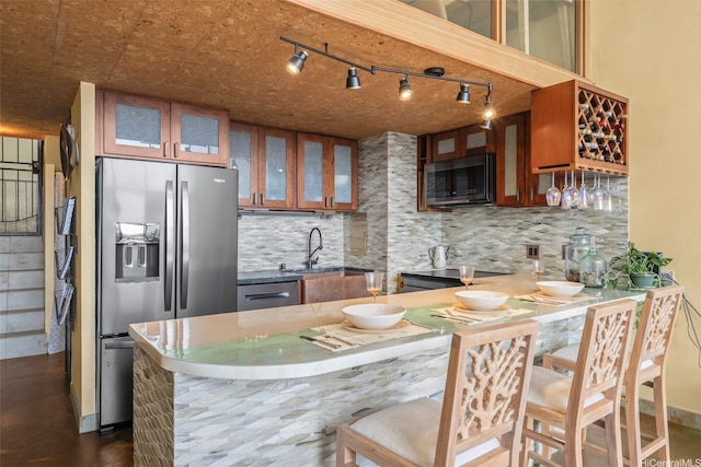 666 Prospect St Unit I502, Honolulu, HI 96813 - kitchen featuring appliances with stainless steel finishes, tasteful backsplash, glass insert cabinets, and brown cabinetry