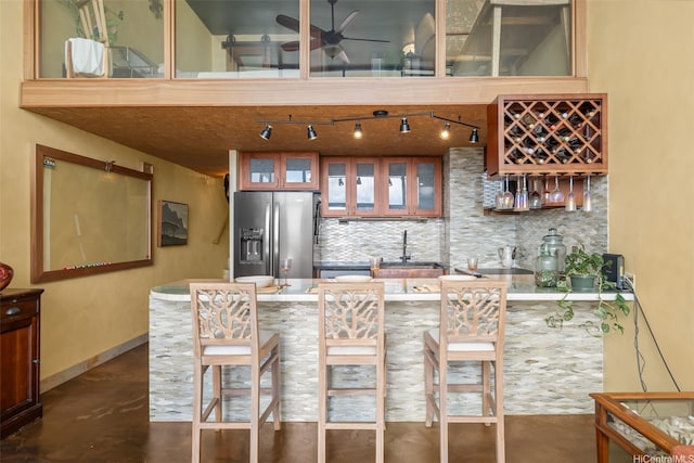 666 Prospect St Unit I502, Honolulu, HI 96813 - indoor bar with stainless steel fridge with ice dispenser, decorative backsplash, finished concrete flooring, and a ceiling fan