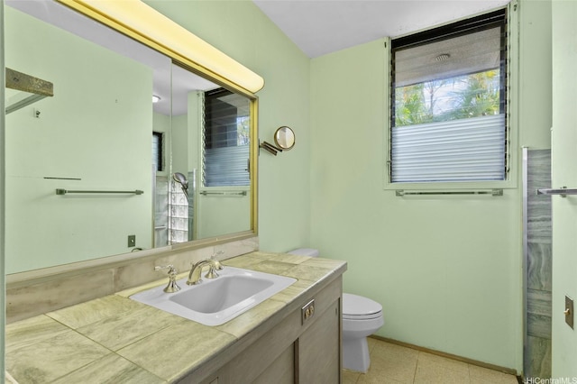 719 Elepaio St, Honolulu, HI 96816 - bathroom with vanity, toilet, tile patterned floors, and baseboards