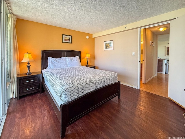 445 Seaside Ave Unit 1120, Honolulu, HI 96815 - bedroom featuring wood finished floors, a textured ceiling, and baseboards