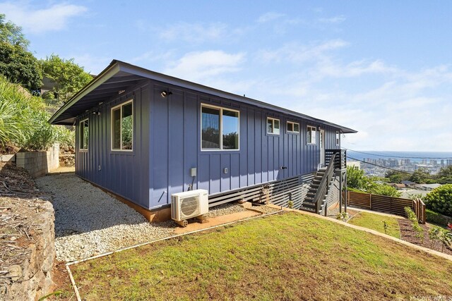 2632 Peter St, Honolulu, HI 96816 - view of side of home with board and batten siding and stairway