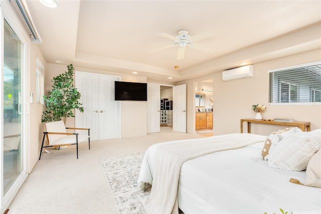 91-2106B Fort Weaver Rd Unit 15, Ewa Beach, HI 96706 - bedroom with a wall mounted air conditioner, a tray ceiling, light carpet, connected bathroom, and recessed lighting