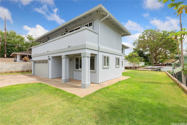 91-2106B Fort Weaver Rd Unit 15, Ewa Beach, HI 96706 - rear view of property with stucco siding, a balcony, and concrete driveway
