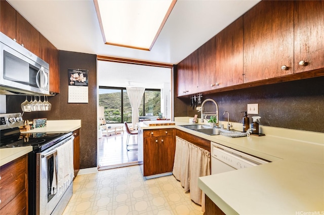 250 Kawaihae St Unit 10E, Honolulu, HI 96825 - kitchen with appliances with stainless steel finishes, light floors, and light countertops