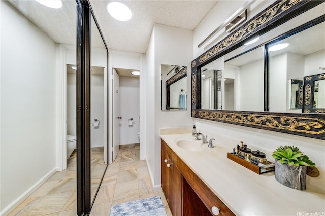 250 Kawaihae St Unit 10E, Honolulu, HI 96825 - bathroom with vanity and a textured ceiling