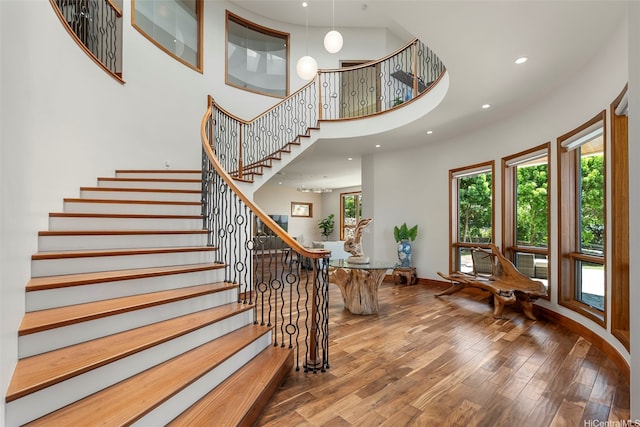 4967 Maunalani Cir Unit B, Honolulu, HI 96816 - staircase featuring wood finished floors, a high ceiling, baseboards, and recessed lighting
