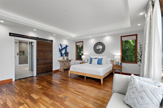 4967 Maunalani Cir Unit B, Honolulu, HI 96816 - bedroom with a barn door, a raised ceiling, baseboards, wood finished floors, and recessed lighting