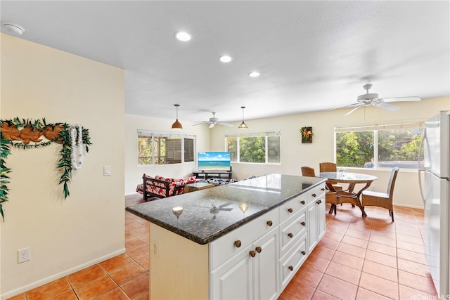 58-292 Kamehameha Hwy, Haleiwa, HI 96712 - kitchen with ceiling fan, freestanding refrigerator, light tile patterned floors, recessed lighting, and white cabinetry