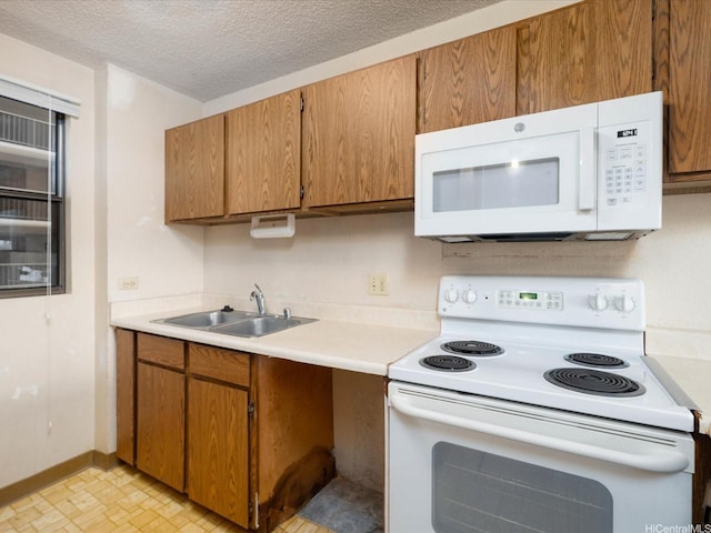 98-487 Koauka Loop Unit B608, Aiea, HI 96701 - kitchen featuring white appliances, a sink, light countertops, brown cabinetry, and a textured ceiling