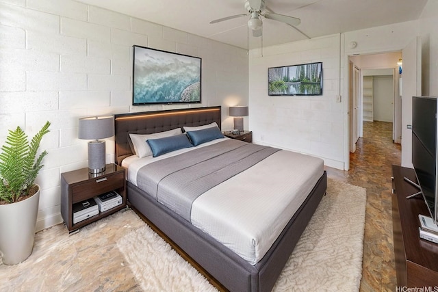 1016 Ehoeho Ave Unit 208, Wahiawa, HI 96786 - bedroom featuring concrete block wall, stone finish flooring, and a ceiling fan