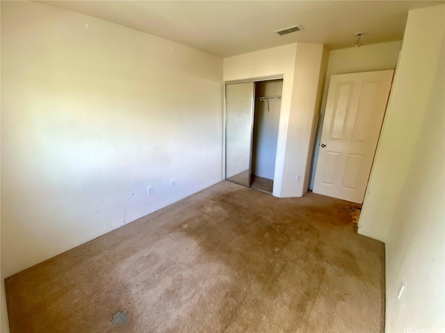 91-1008 Kaiopua St Unit M2, Ewa Beach, HI 96706 - unfurnished bedroom with carpet floors and a closet