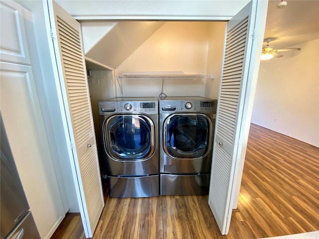 91-1008 Kaiopua St Unit M2, Ewa Beach, HI 96706 - laundry area featuring wood finished floors, washing machine and dryer, and a ceiling fan