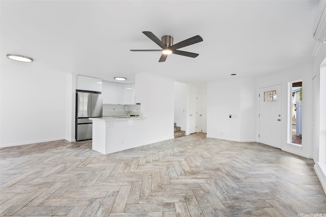 91-1041 Waihuna St, Ewa Beach, HI 96706 - unfurnished living room with ceiling fan and stairs
