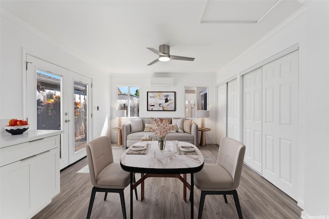 91-1041 Waihuna St, Ewa Beach, HI 96706 - dining room with an AC wall unit, wood finished floors, crown molding, attic access, and a ceiling fan